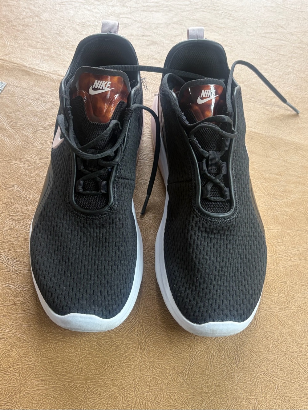 Nike womens Black Athletic Sneakers with White Sole and Rose Accent